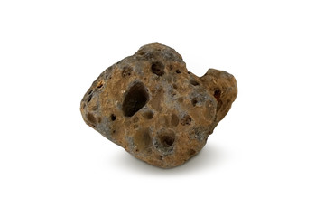 basalt on white background. A basalt is a fine-grained basic igneous rock containing essential...