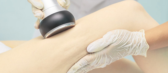 Cavitation rf body treatment. Female ultra sound lipo machine. Spa contouring. Doctor hands