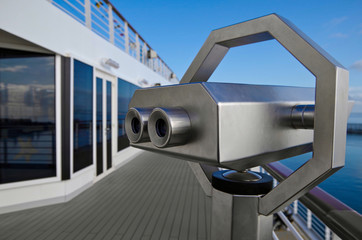 Amazing views through binocular on deck of cruiseship or cruise ship liner