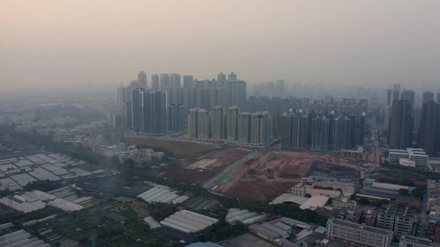 Block of newly built apartment buildings in newly developing territories next to suburb areas, Guangzhou, China