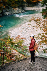 Asian woman is standing at view point  in Kurobe gorge, Toyama, Japan