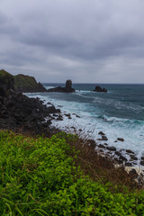 Beautiful Nature sea landscape scene with Black stone of Jeju Island, South Korea