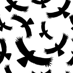 Seamless pattern with the silhouette of a flying eagle on a light sky background. Dark ink hand drawn logo in the art style of vintage engraving graphic style.