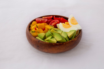 Salad with mango, avocado, egg, romeo tomatoes