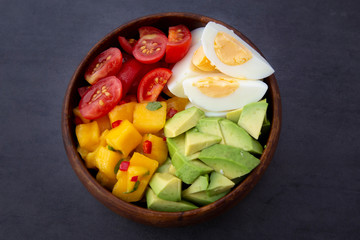 Salad with mango, avocado, egg, romeo tomatoes