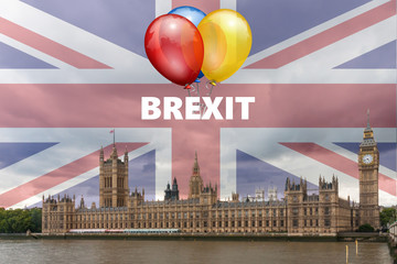 The Palace of Westminster ak.a.  the Houses of Parliament with Brexit text and balloons to celebrate leaving the European Union on 31st January 2020