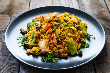 Paella seafood on wooden background