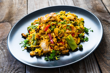 Paella seafood on wooden background