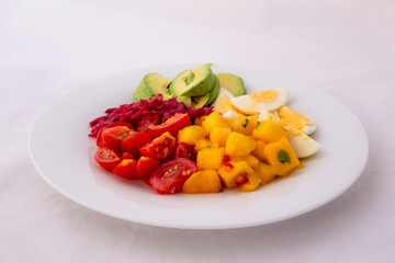 Salad with mango, avocado, egg, romeo tomatoes