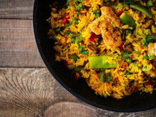 Paella seafood on wooden background