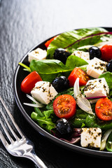 Fresh greek salad - feta cheese, tomato, lettuce, black olives and onion