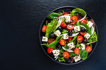 Fresh greek salad - feta cheese, tomato, lettuce, black olives and onion