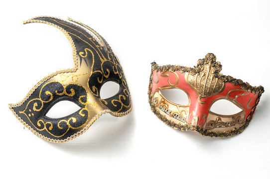 Two theater or mardi gras venetian masks on white background