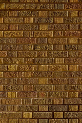 Fototapeta premium Greenish brown vintage brick wall texture background in Flemish bond brickwork pattern