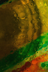 colorful cooking oil bubbles in water