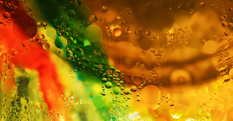 colorful cooking oil bubbles in water. © Malik