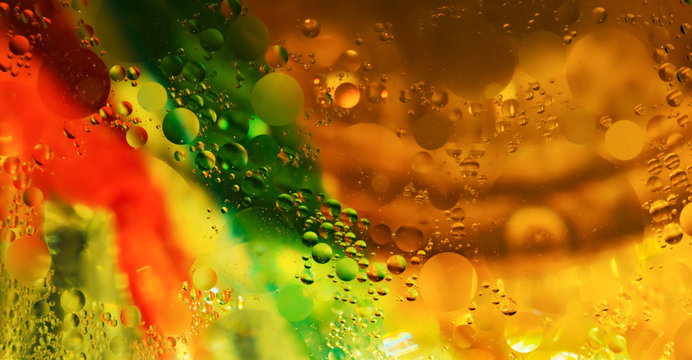 colorful cooking oil bubbles in water.