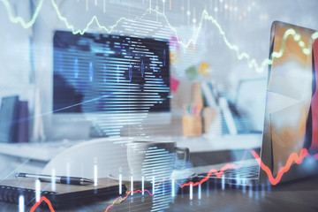 Stock market graph on background with desk and personal computer. Multi exposure. Concept of financial analysis.