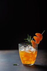 Alcoholic cocktail with mandarins