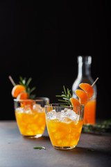 Alcoholic cocktail with mandarins