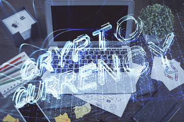 Double exposure of blockchain theme hologram and table with computer background. Concept of bitcoin crypto currency.