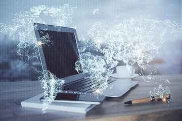 Computer on desktop with social network theme icon. Multi exposure. Concept of international connections.