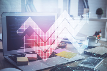 Computer on desktop with point up arrows hologram. Double exposure. Concept of success.