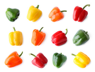 Set of different ripe bell peppers on white background