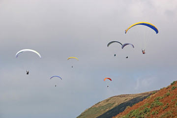 Paragliders flying above Rhossili