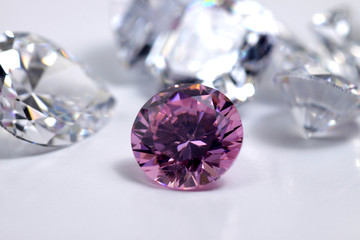 Macro shoots of pink color round shaped shiny diamond isolated