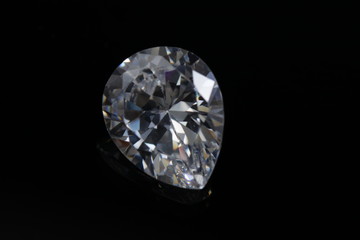 Close up shoot of shinny diamond that faceted to pear shapes isolated background