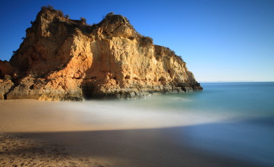 Fototapeta na wymiar Milky waters on the beach, Lagos, Algarve, Portugal