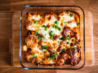 Pasta casserole with barbecue chicken breast, cheese and vegetables