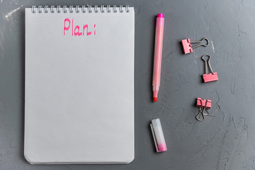 White notebook template on a spring with a pink inscription 