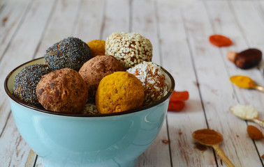 Energetic sweets made from dried apricots, dates, almonds, hazelnuts, dried nuts, seeds, dried fruits and honey. Homemade useful candies. Raw and vegan sweets. Energy balls.