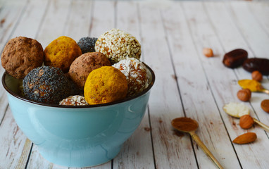 Energetic sweets made from dried apricots, dates, almonds, hazelnuts, dried nuts, seeds, dried fruits and honey. Homemade useful candies. Raw and vegan sweets. Energy balls.