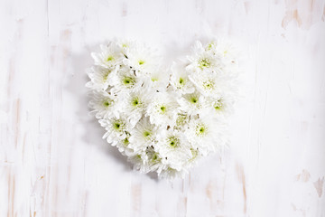 heart shaped of white flowers, top view