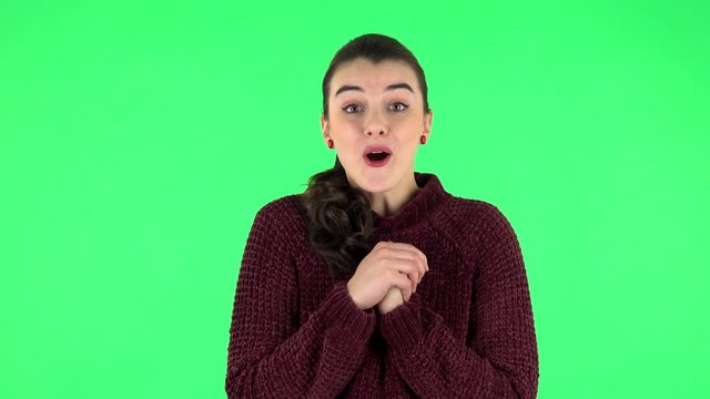 Cute girl with wow face expression and tender smiling. Green screen