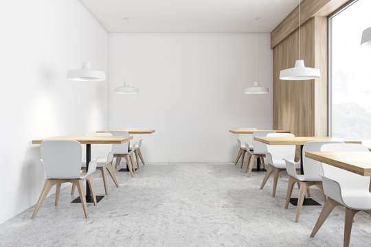 Stylish white and wooden coffee shop interior