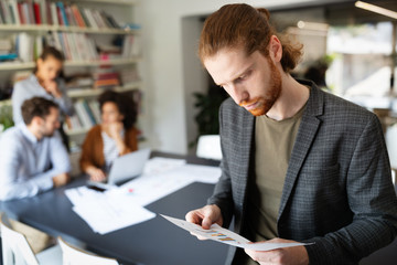 Group of young business people and designers.They working on new project.Startup concept.