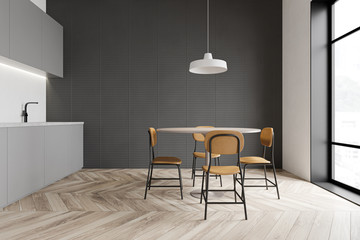 Gray kitchen interior with brown chairs