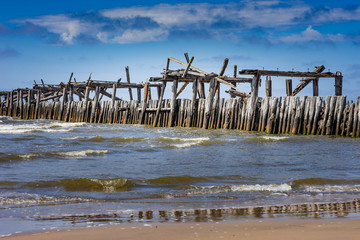 Old harbor ruins. Blue sea and port. Harbour in Baltic sea, Latvia, Europe