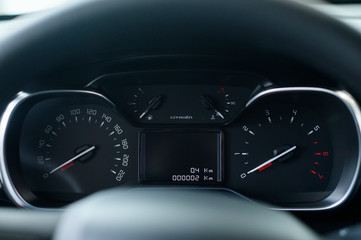 Dashboard of a modern new car, odometer and speedometer.