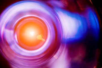 Wine and martini glasses in shelf above a bar rack in restaurant. Empty clean glasses in bar.
