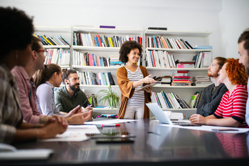 Group of business people collaborating on project in office