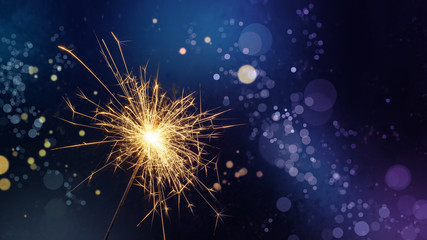 Magic burning sparkler on night background