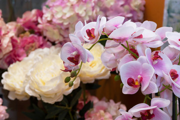 Artificial orchids and roses