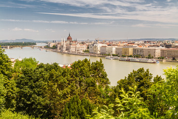 River Danube in Budapest Hungary, parliament building and trees.
