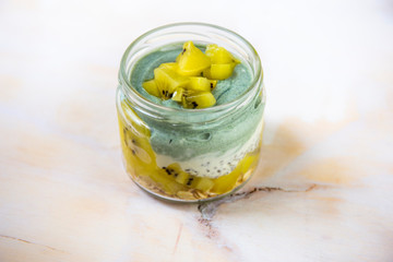 Homemade Chia pudding with kiwi in the glass jar