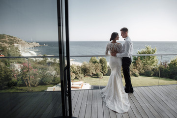 Loving couple at the hotel on a honeymoon.Just married. Honeymoon concept. Romantic relations. True...